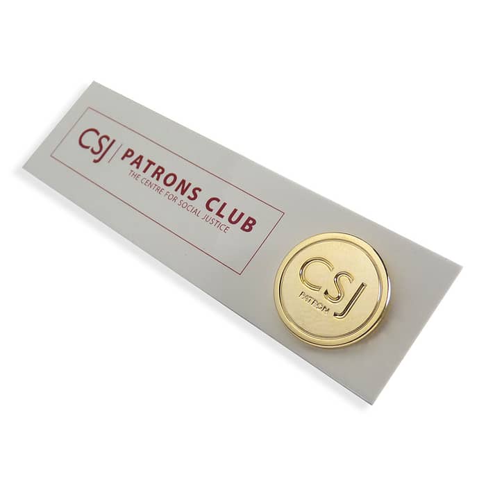 bespoke gold badge with backing card
