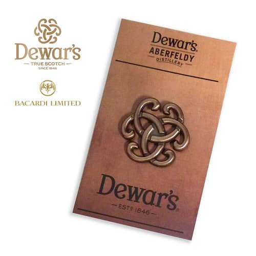 antique 3d badge on backing card